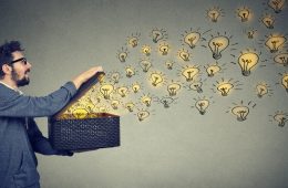Image of man opening box of light bulbs