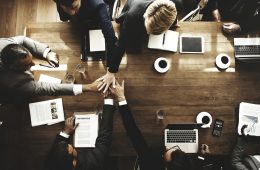 Image of people working at a desk.