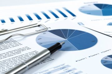 Image if pen on top of forecasting report.