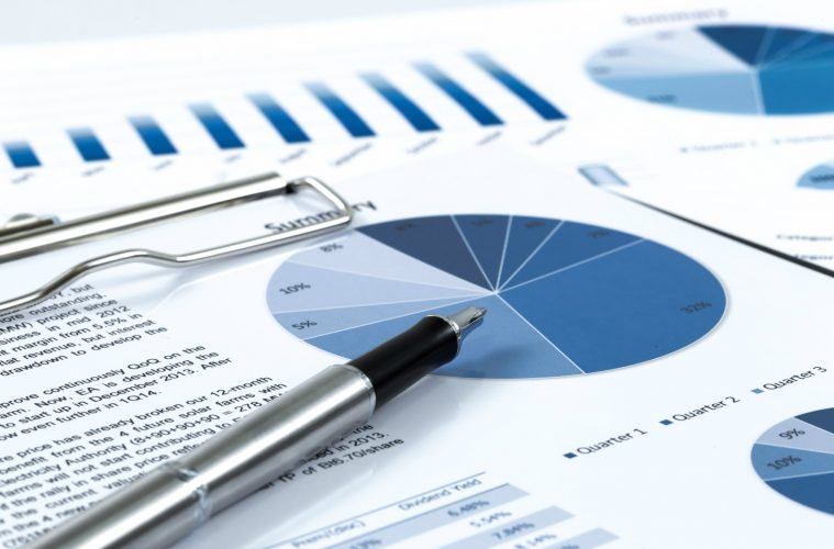 Image if pen on top of forecasting report.