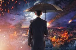 Image of man looking out across burning city