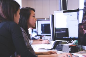 Forecasters working together at desk