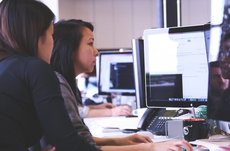 Forecasters working together at desk